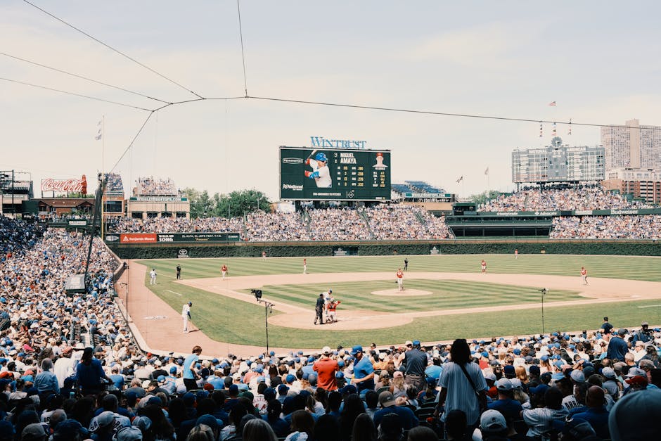 A lively baseball game at Wrigley Field with a packed stadium and urban skyline.